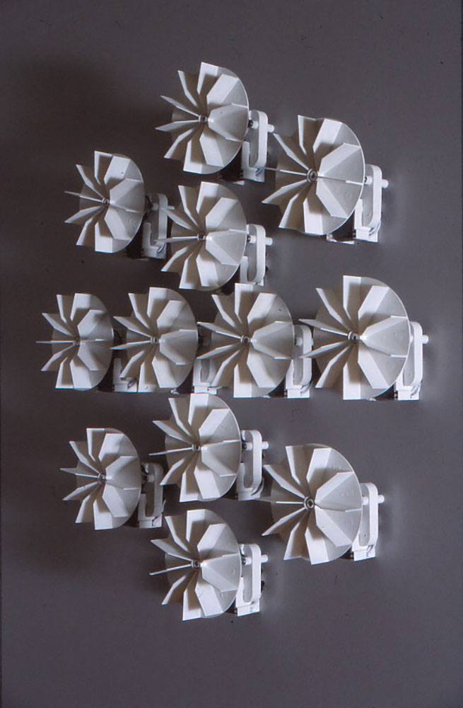 Round objects resembling pinwheels