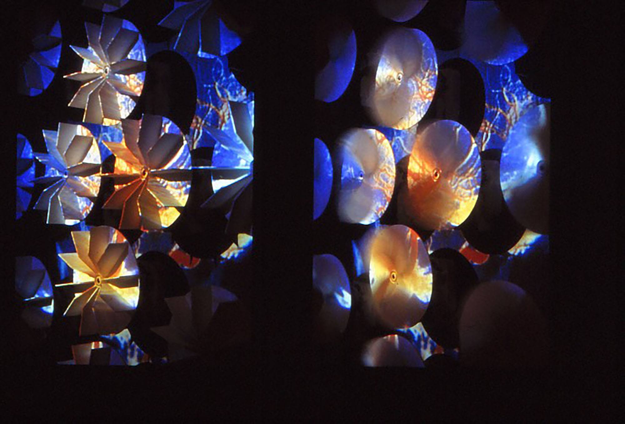 Light and color patterns in blue and orange projected onto round objects