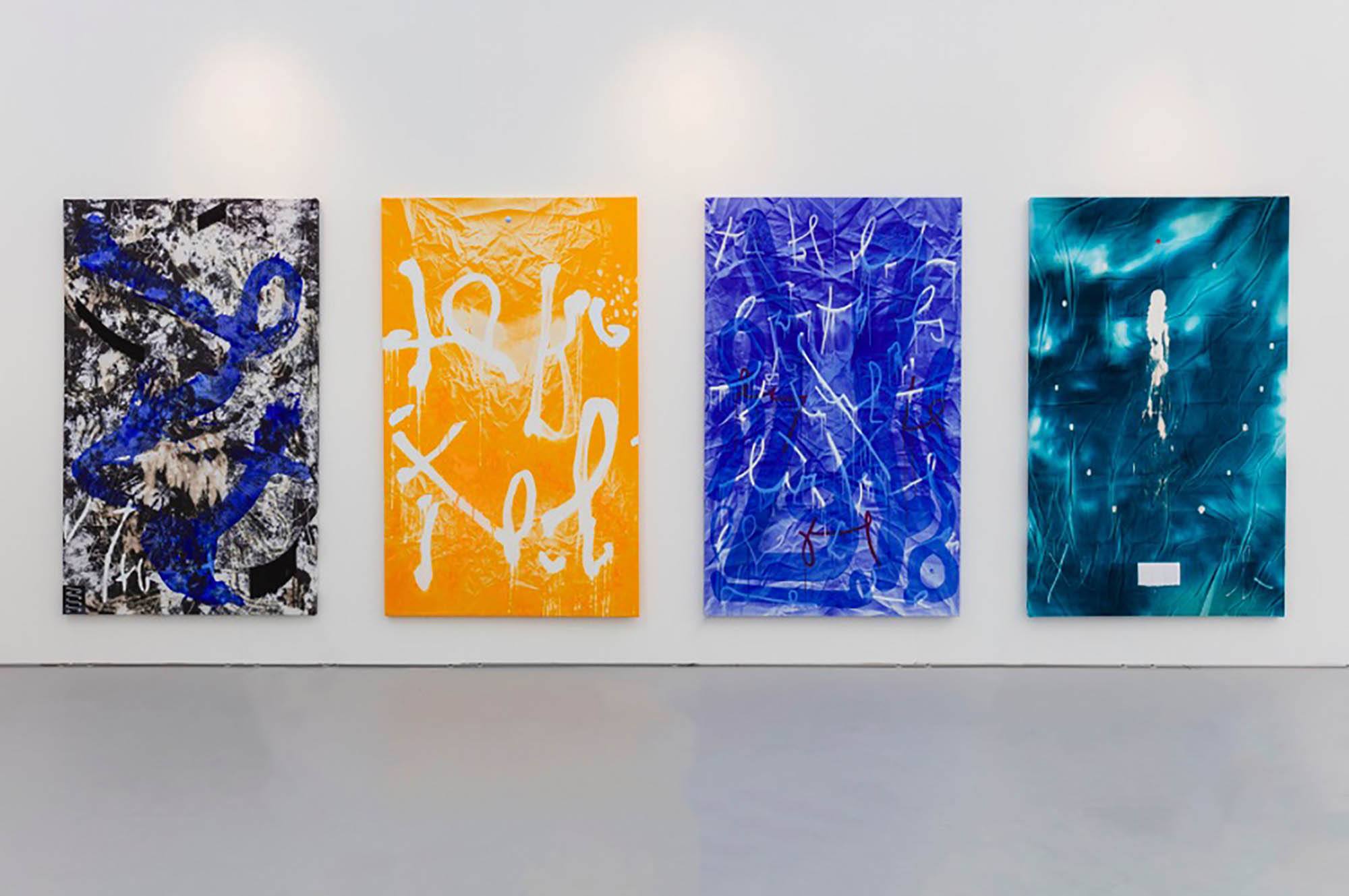 Four abstract paintings in blue, orange, black and white
