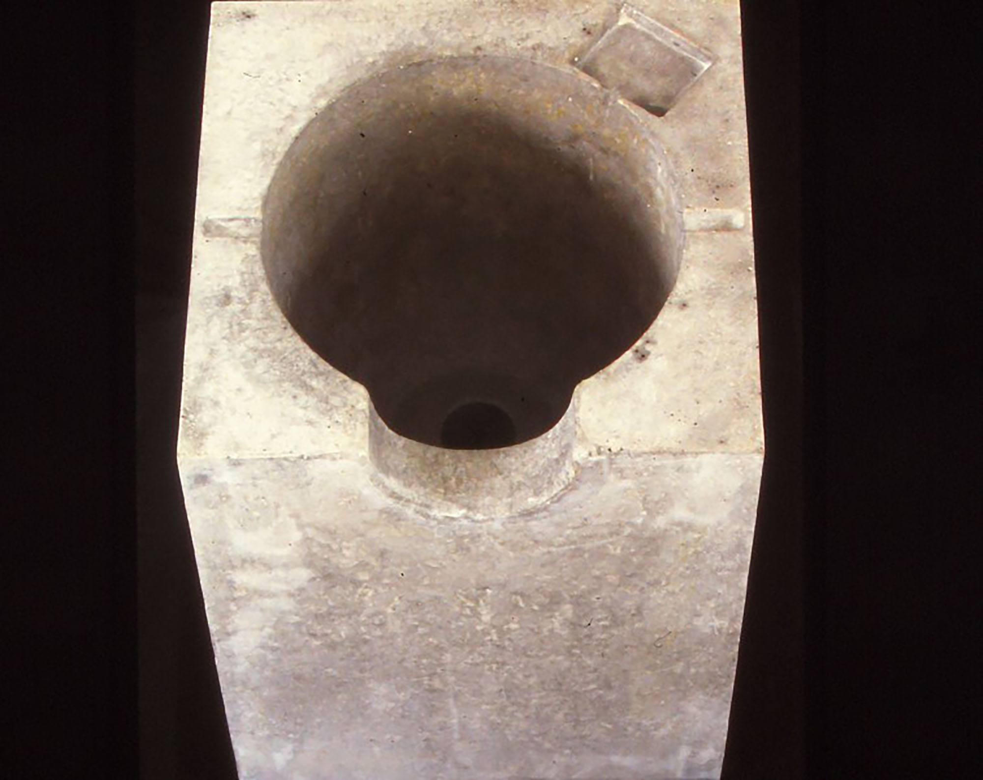 A toilet or sink carved from a stone