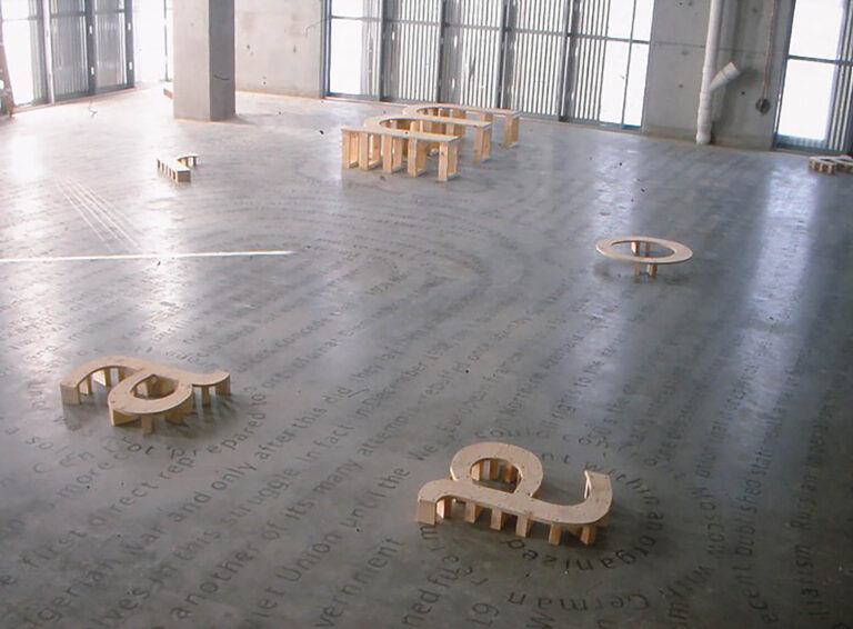 Installation image of letters from the alphabet framed in wood