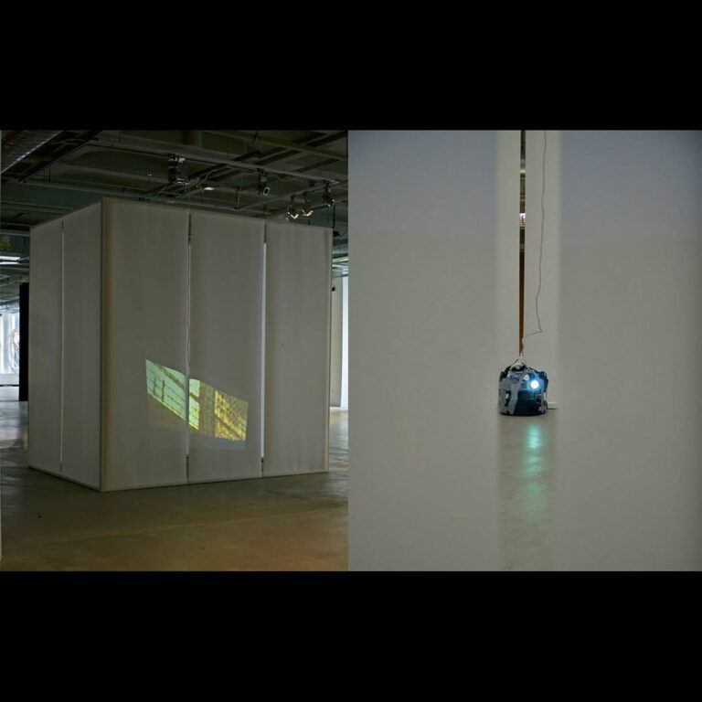 An installation view containing a projection of a facade
