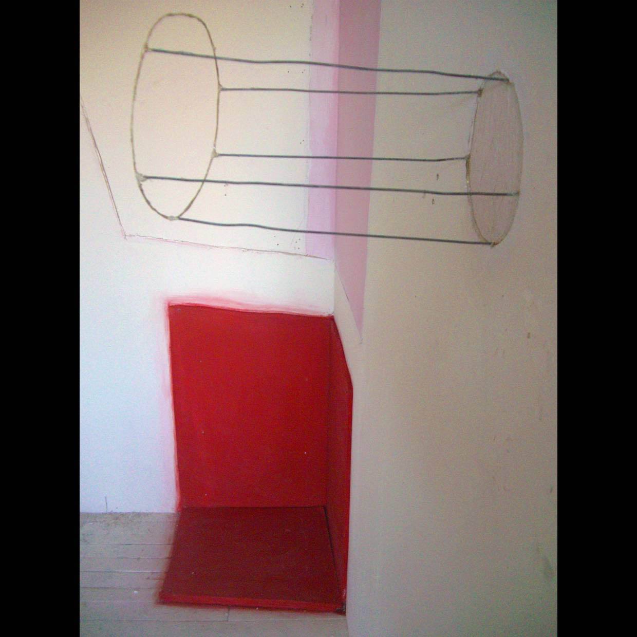 An installation image of a gallery space with three dimensional shapes drawn at the intersection of two walls