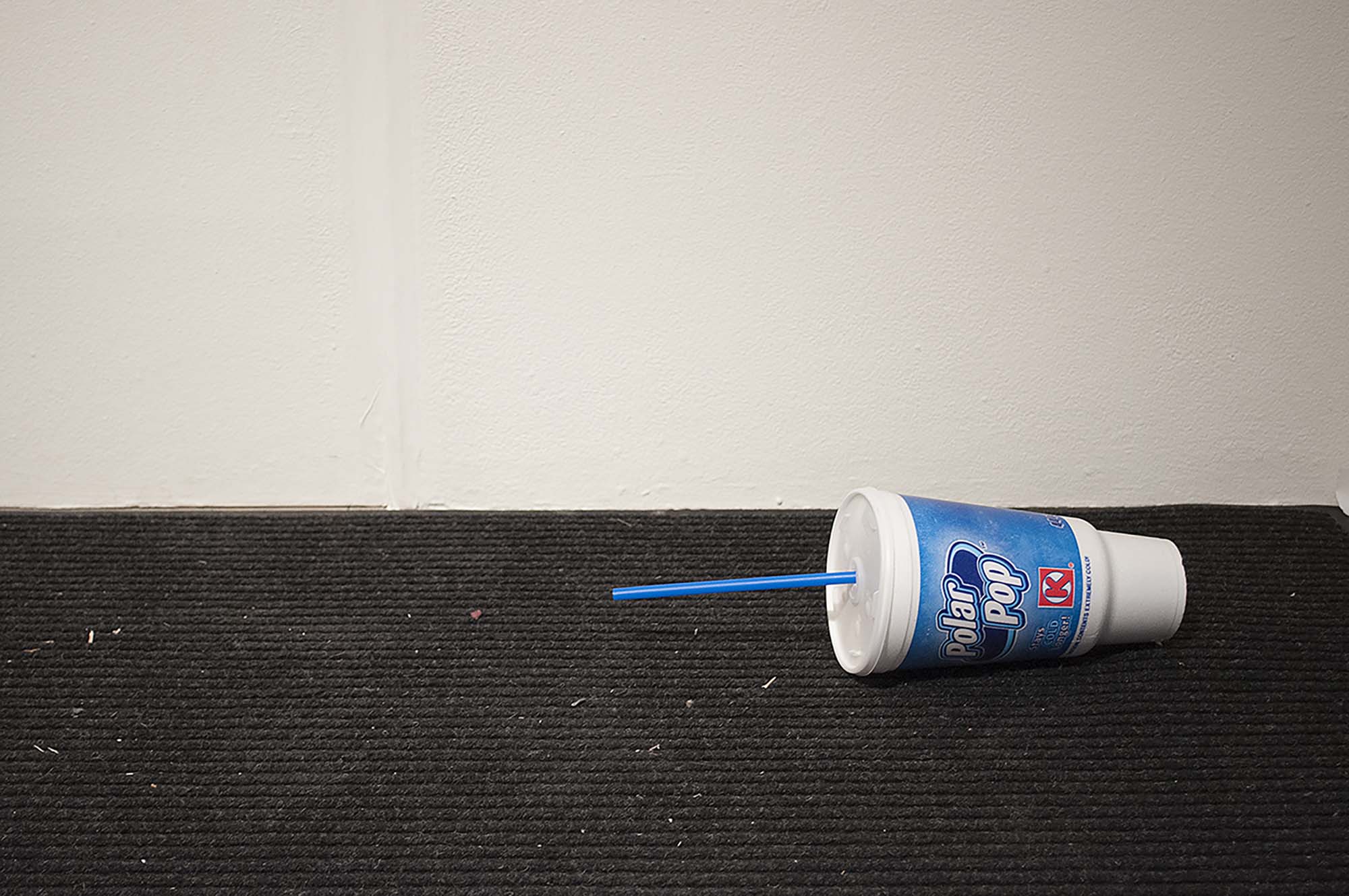 A plastic Polar Pop cup laying on its side