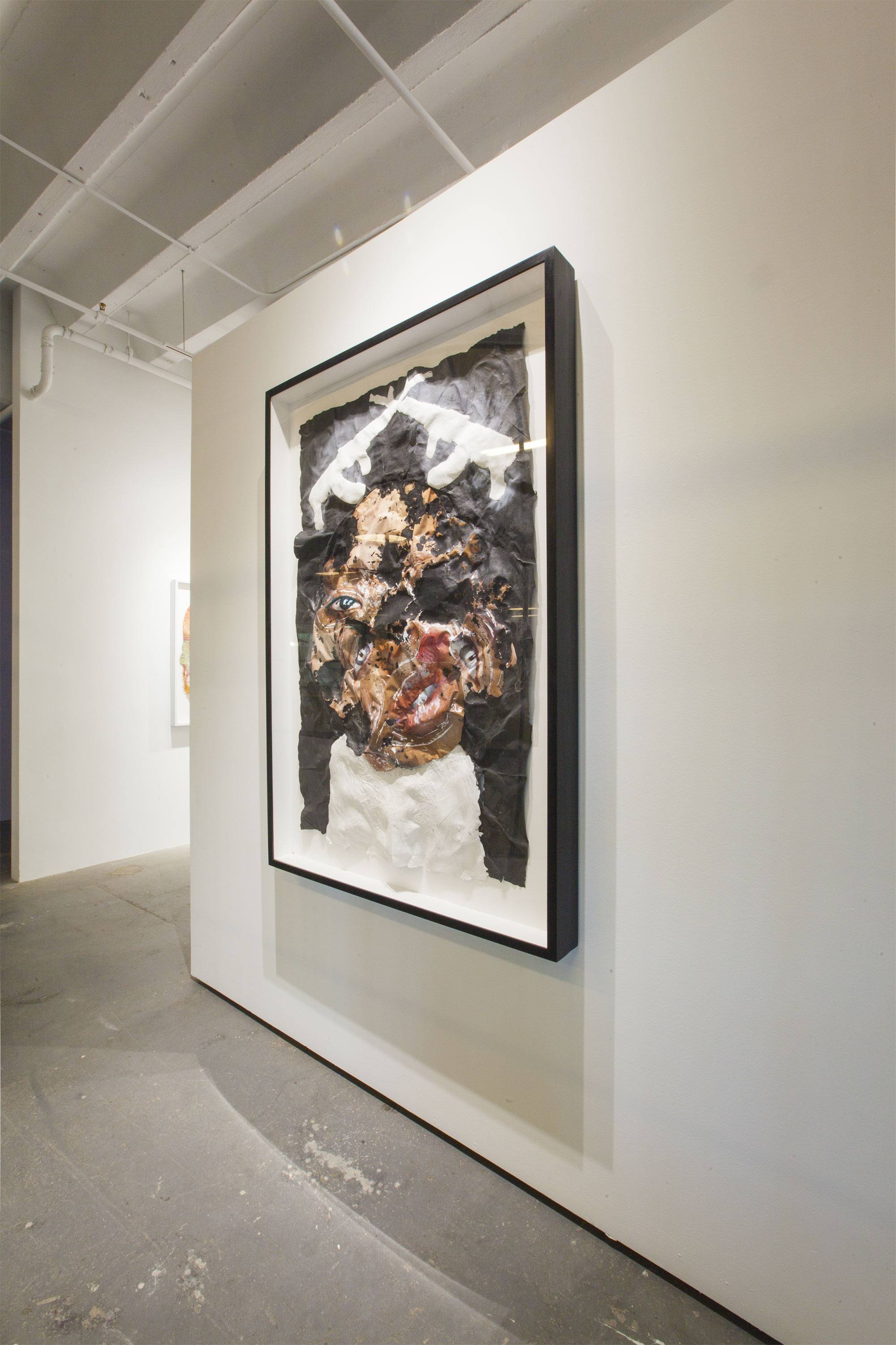 An installation image containing a sculptural abstract painting