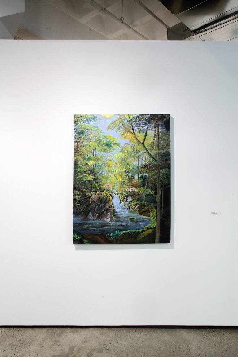 Installation image of a painting of a forest scene