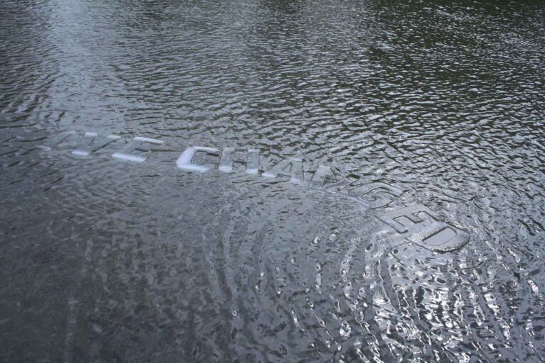 The words "I've changed" made of ice, floating in water