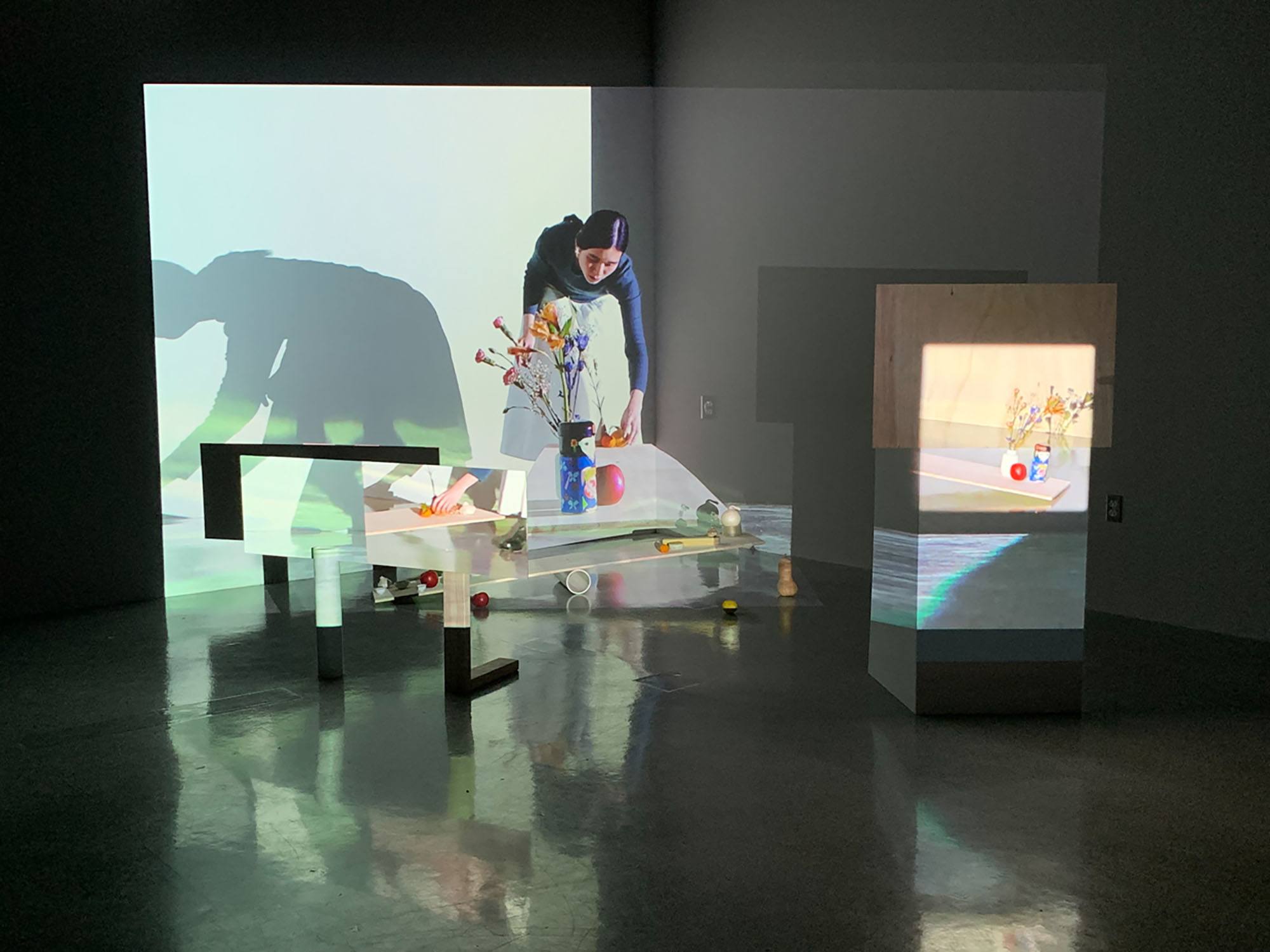 A gallery installation with projections on multiple surfaces
