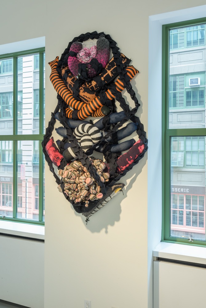 An installation image of an artwork made from shaped cushions