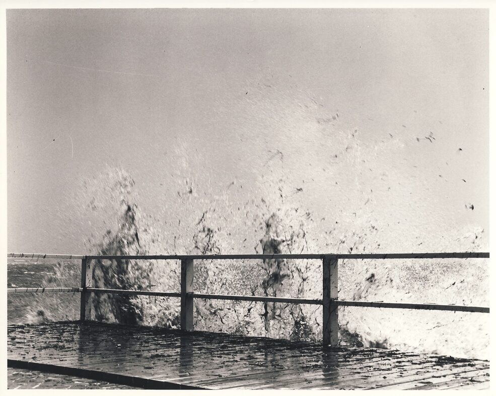 waves splashing against a pier