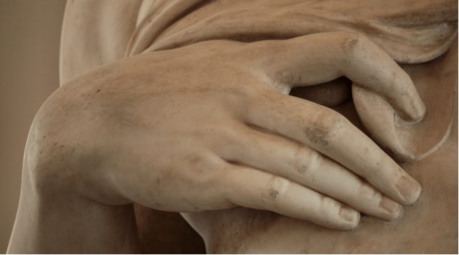 Detail of a hand on a ceramic sculpture