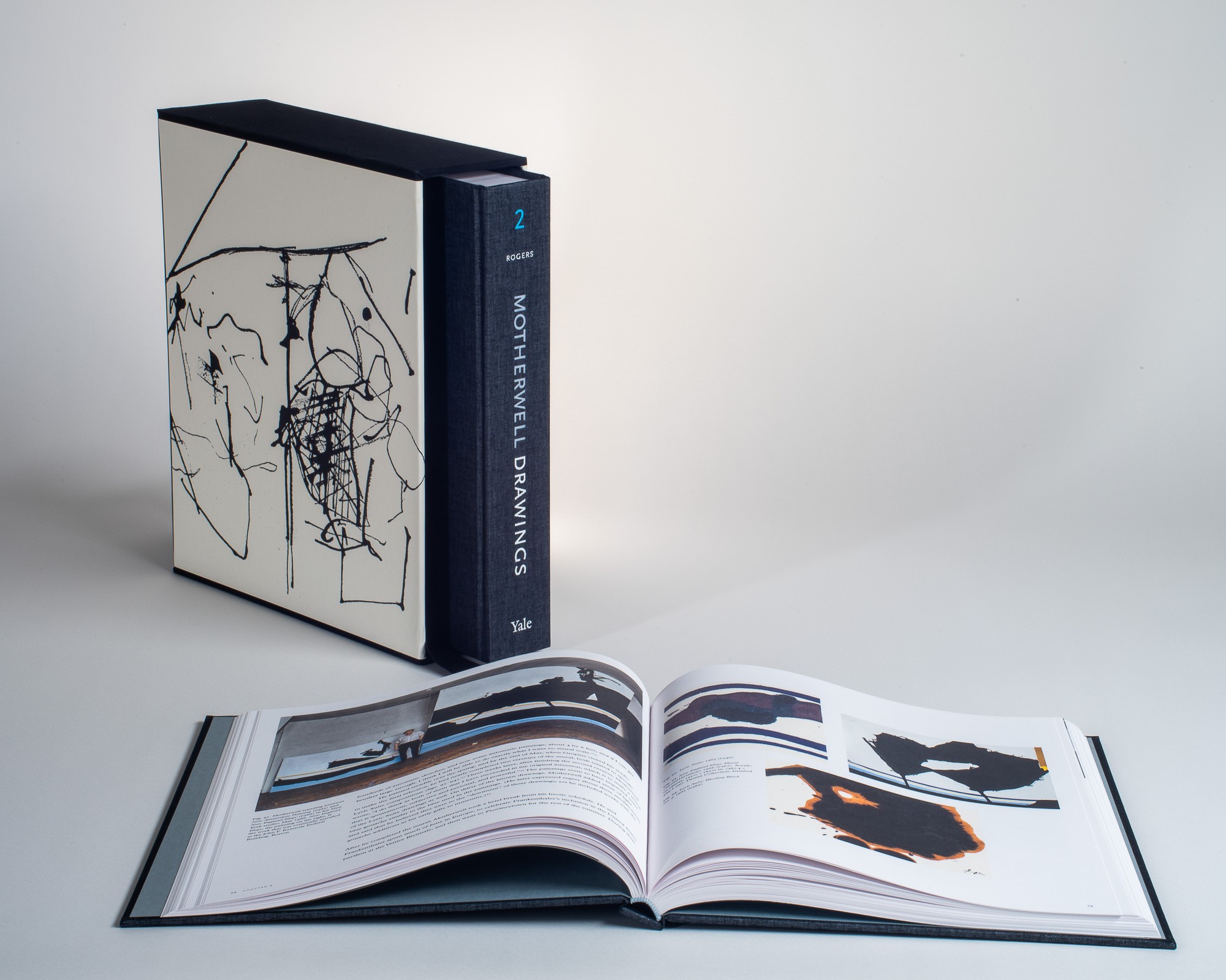 The Motherwell Drawings Catalogue Raisonné case standing upright, with volume 1 opened to a page