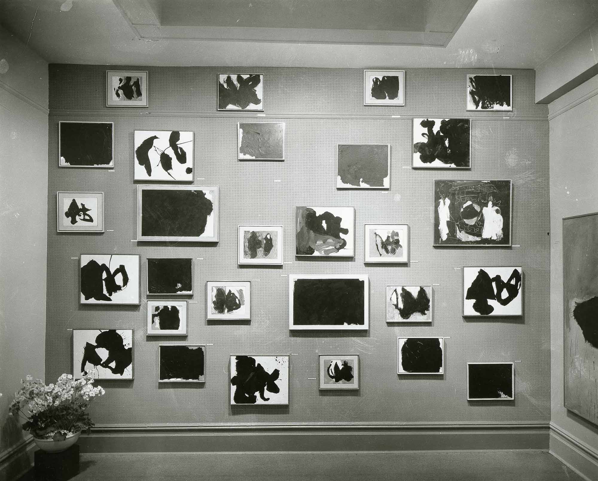 Twenty eight small works by Motherwell are displayed on a wall at Sidney Janis Gallery, 1959.