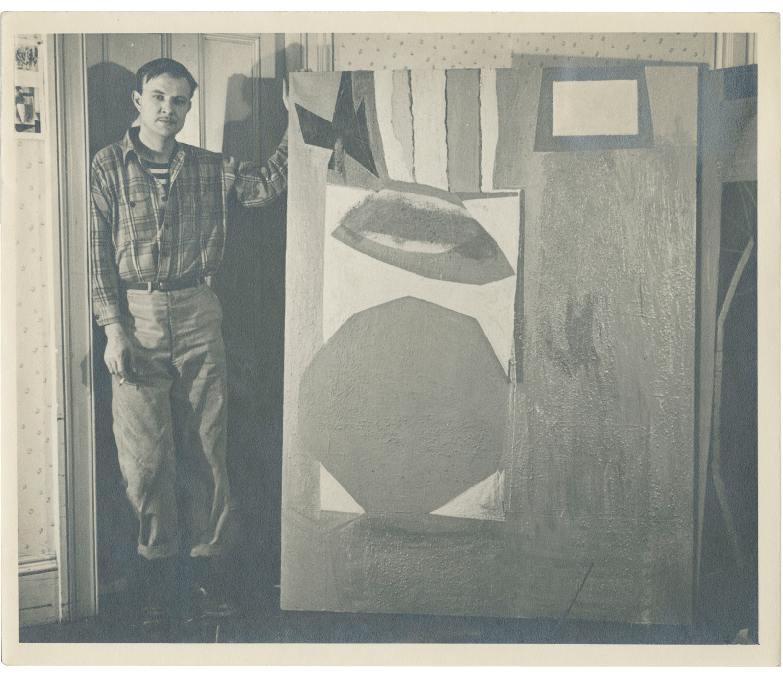 Robert Motherwell posing beside his painting "Western Air"