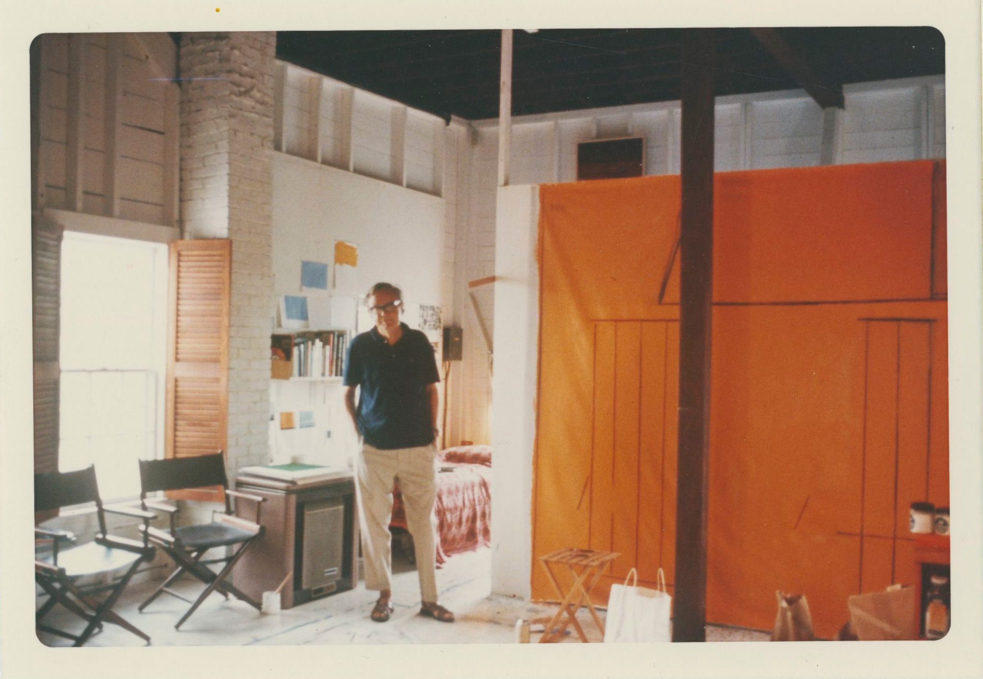 Robert Motherwell standing in his studio