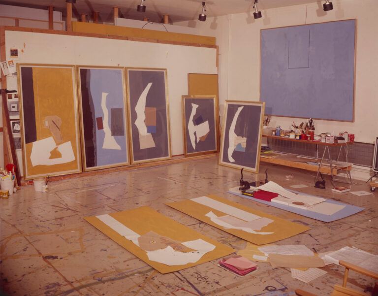 a group of collages on the floor and wall in Motherwell's studio